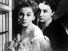 The second Mrs. de Winter (left, played by Joan Fontaine) is tormented by the obsessive Mrs. Danvers in Rebecca.