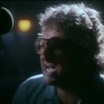 Randy Newman singing with TV cops