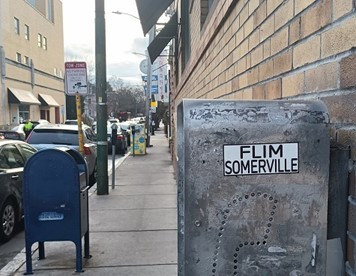 Film... mailbox... phone booth... just need to add somebody writing a check for their cable bill on the way to the office to complete the BINGO.