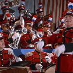 Conducting a band playing music he didn't acutally write
