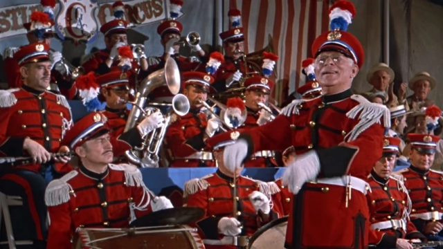 Conducting a band playing music he didn't acutally write